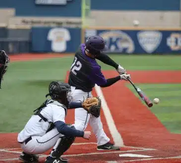 baseball player swinging bat