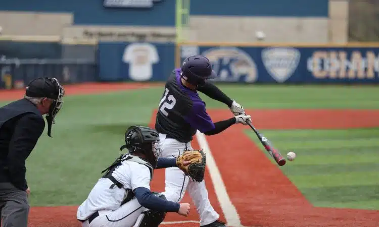 baseball player swinging bat