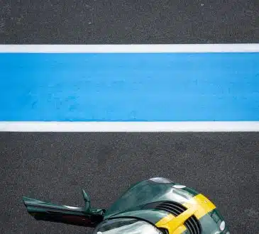 green and yellow car on road